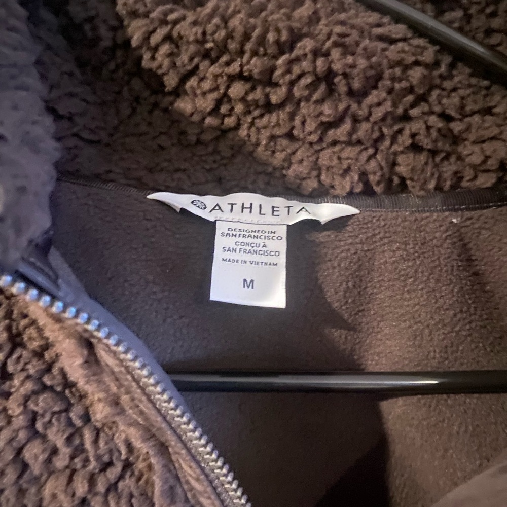 It’s like chocolate colored pullover size medium